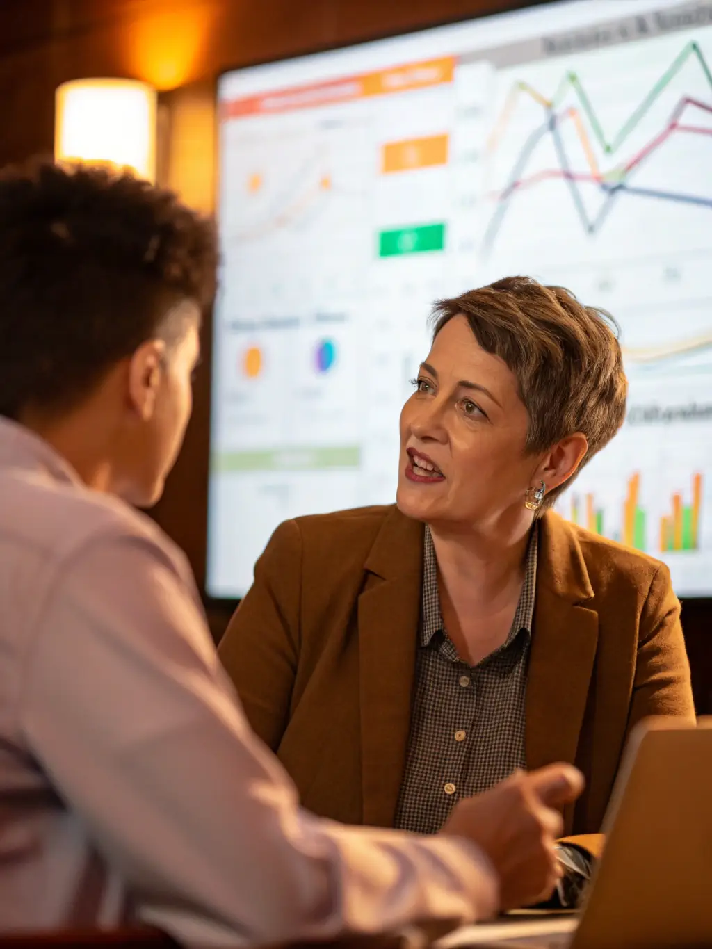 An image of a financial advisor explaining sustainable investment options to a client, highlighting Wealth Sorted's commitment to responsible investing.